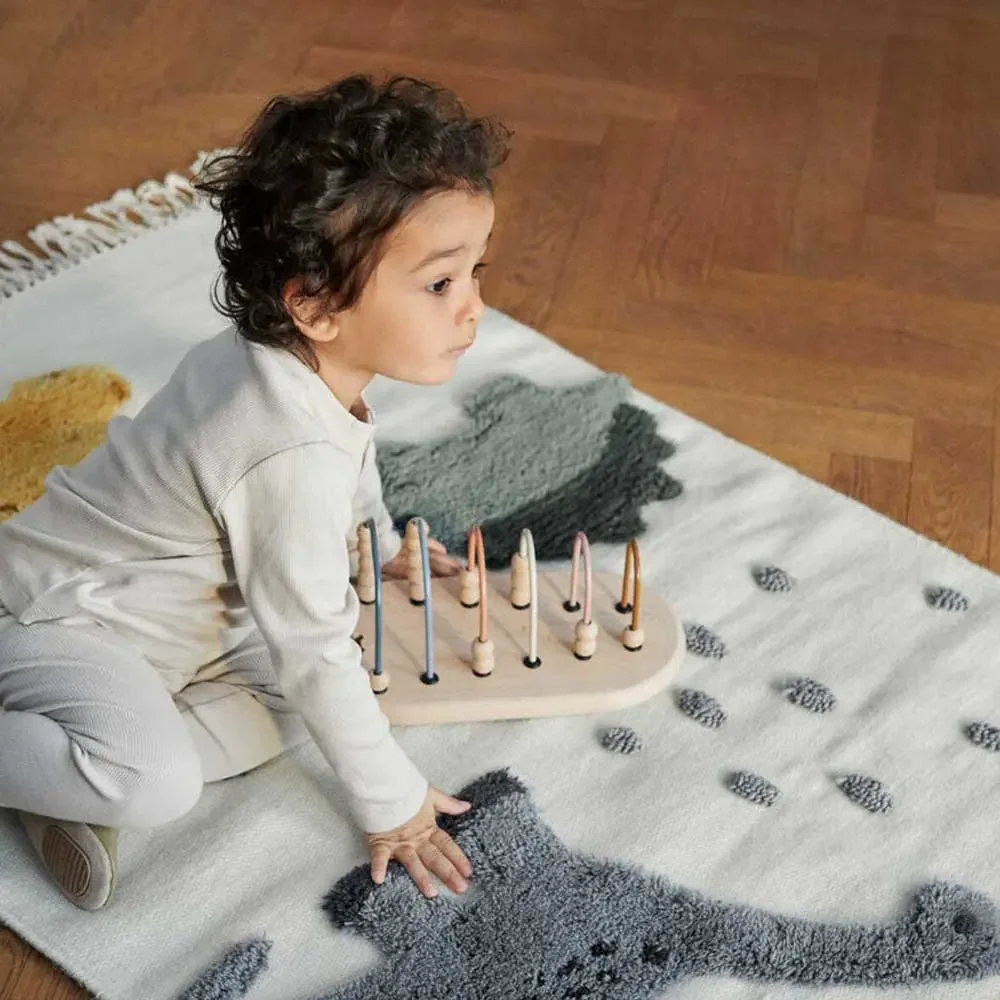 Liewood--Bent--Kinderteppich-Dino-beige-Multi-Mix-458418_2.jpg